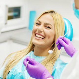 Young Woman At The Dentist Female dentist and young woman patient in dentist office.